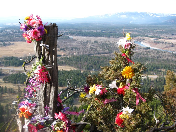 Dedication or memorial.  Flathead River and Big Mountain in background.